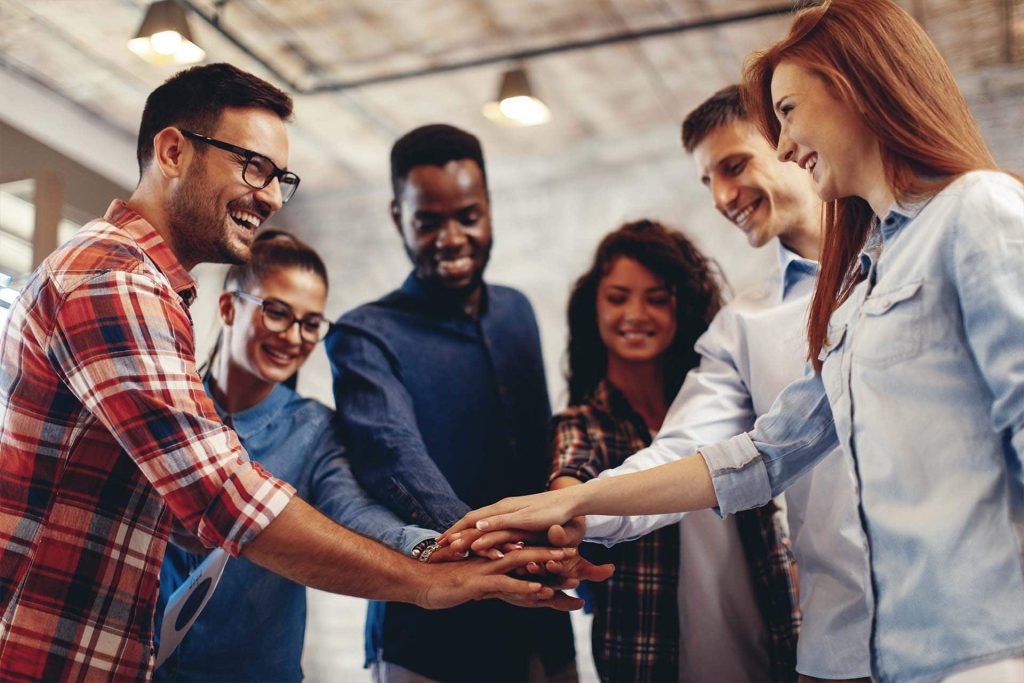 collaboration_people showing team spirit focus on hands